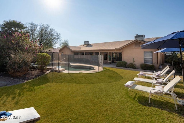 rear view of house featuring a fenced in pool, central AC, a patio area, and a lawn