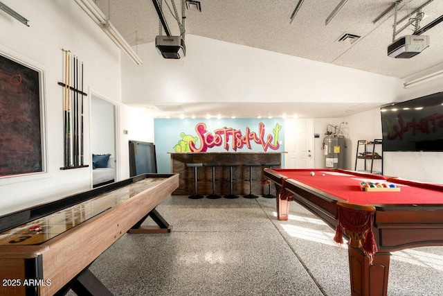 recreation room featuring high vaulted ceiling, pool table, electric water heater, bar area, and a textured ceiling