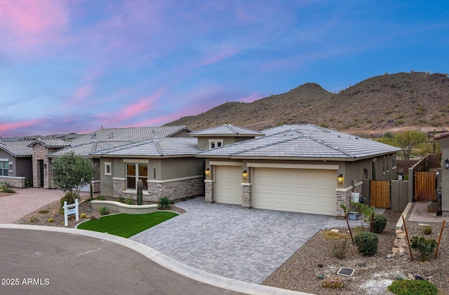 view of front of house featuring a mountain view and a garage