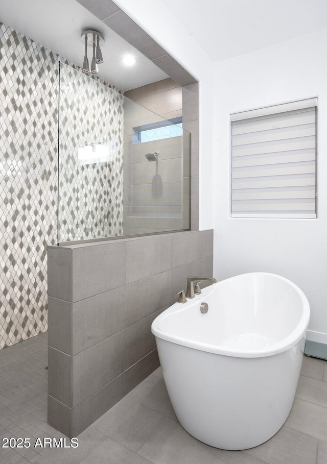 bathroom featuring tile walls, tile patterned flooring, and shower with separate bathtub