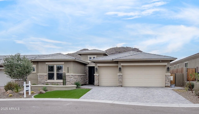 prairie-style home featuring a garage