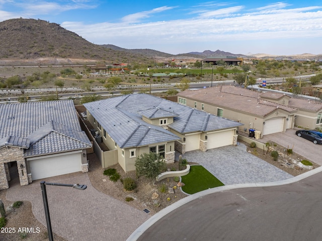 drone / aerial view featuring a mountain view