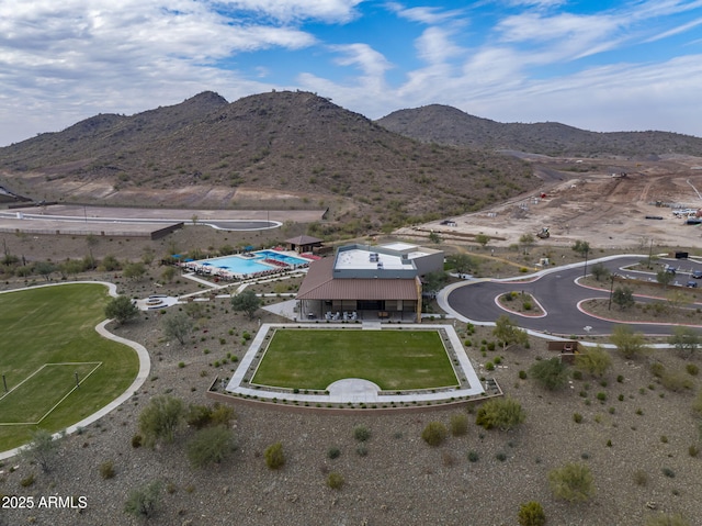 birds eye view of property with a mountain view