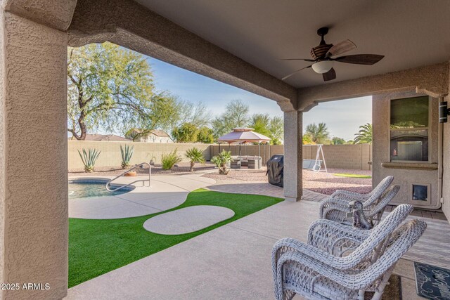 view of patio / terrace featuring an outdoor hangout area, a fenced in pool, and ceiling fan