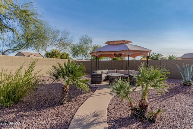 view of yard featuring a gazebo and an outdoor hangout area