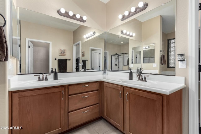 bathroom featuring tile patterned floors, vanity, and walk in shower