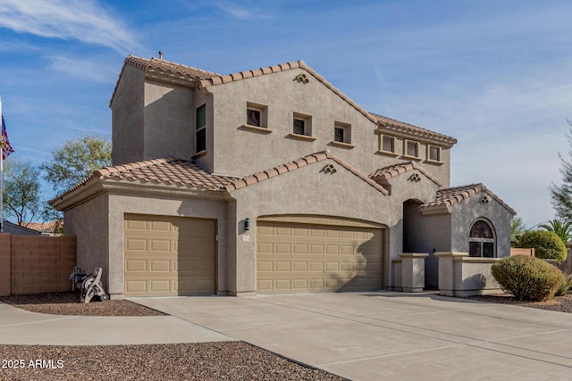 mediterranean / spanish-style home with a garage