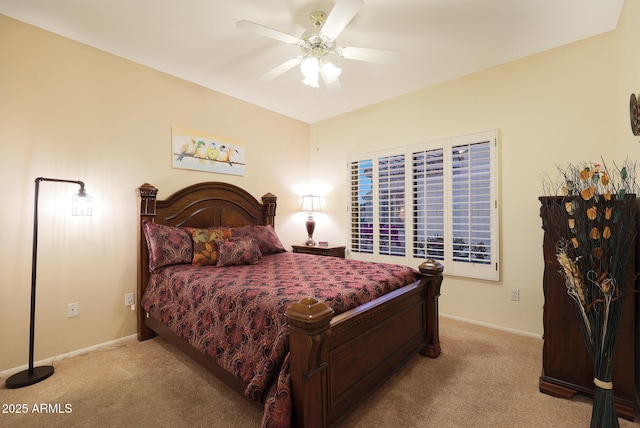 bedroom featuring light colored carpet and ceiling fan