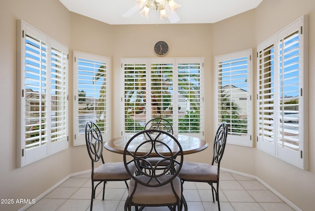 dining area featuring ceiling fan and light tile patterned floors