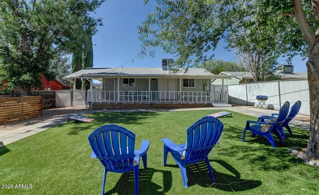 back of property with a patio and a yard