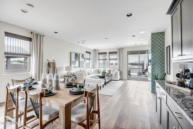 dining space featuring light wood-type flooring