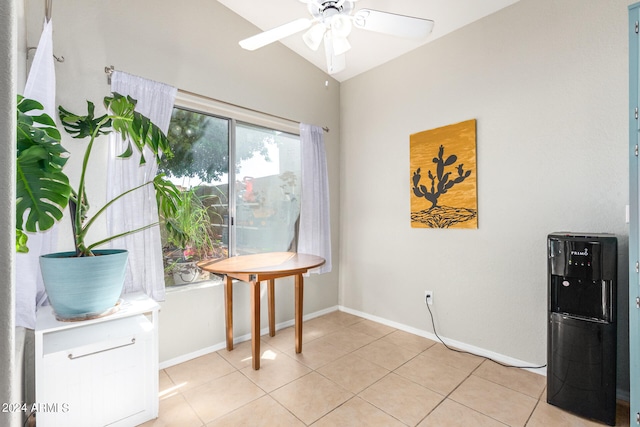 sitting room with light tile patterned floors, vaulted ceiling, and ceiling fan