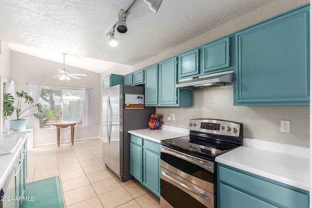 kitchen featuring blue cabinetry, appliances with stainless steel finishes, vaulted ceiling, and ceiling fan