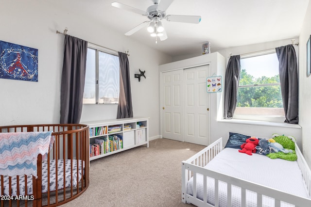 bedroom with carpet flooring, ceiling fan, and a closet