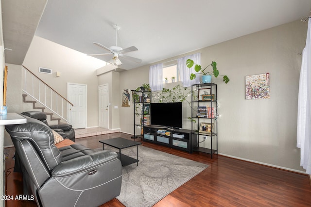 living room featuring ceiling fan and hardwood / wood-style flooring