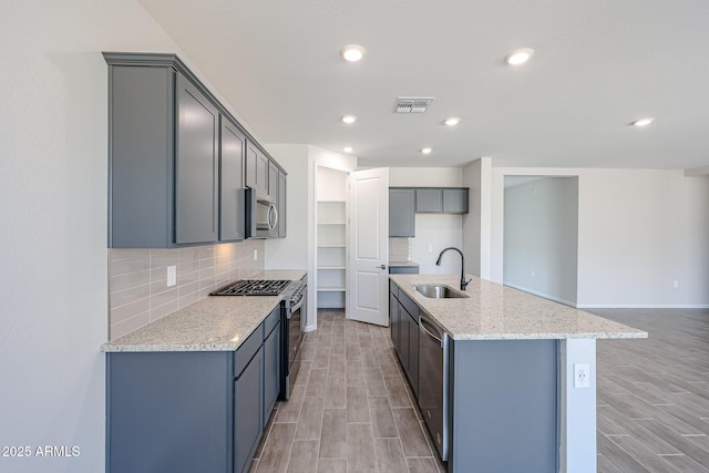 17716 W Fulton St, Goodyear, AZ 85338 - kitchen featuring a sink, appliances with stainless steel finishes, wood finish floors, and visible vents