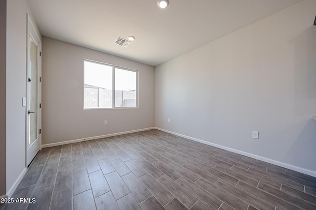 17716 W Fulton St, Goodyear, AZ 85338 - spare room with recessed lighting, baseboards, dark wood-style floors, and visible vents