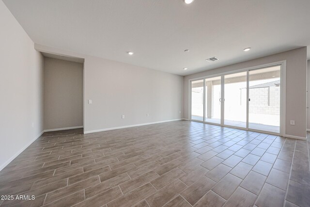 17716 W Fulton St, Goodyear, AZ 85338 - unfurnished room featuring recessed lighting, baseboards, and wood finished floors