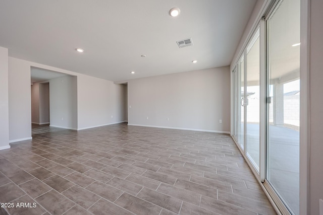17716 W Fulton St, Goodyear, AZ 85338 - spare room with baseboards, recessed lighting, and visible vents