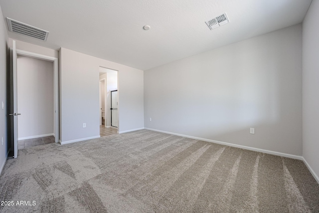 17716 W Fulton St, Goodyear, AZ 85338 - unfurnished bedroom featuring carpet flooring, baseboards, and visible vents