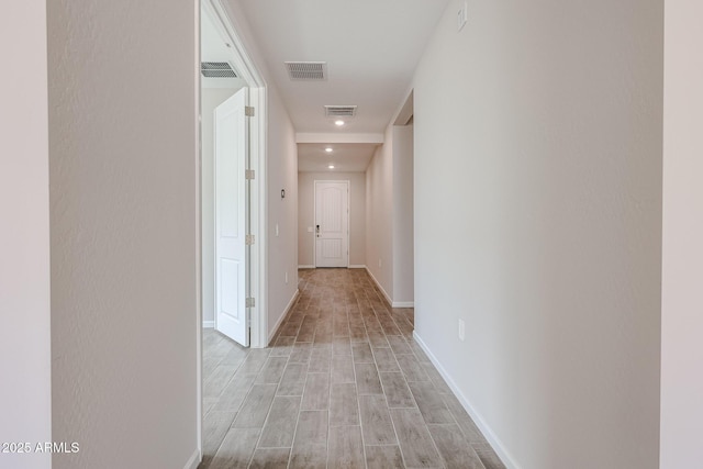 17716 W Fulton St, Goodyear, AZ 85338 - hallway with baseboards, light wood-style flooring, and visible vents