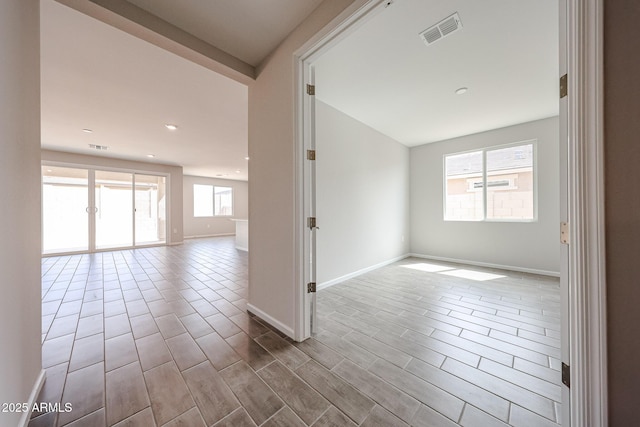 17716 W Fulton St, Goodyear, AZ 85338 - empty room featuring baseboards, recessed lighting, and visible vents