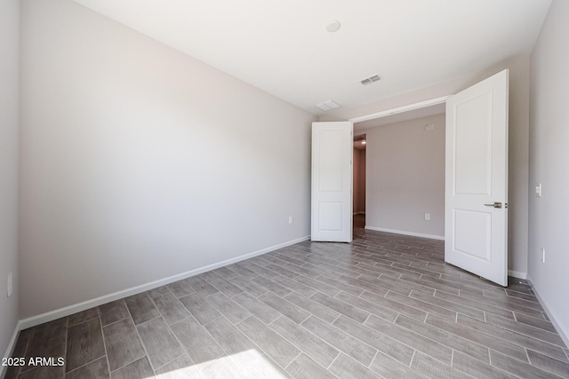 17716 W Fulton St, Goodyear, AZ 85338 - empty room featuring baseboards, visible vents, and light wood-style floors