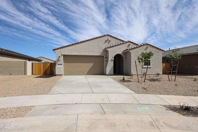 17716 W Fulton St, Goodyear, AZ 85338 - view of front facade featuring a garage, stucco siding, concrete driveway, and a tile roof