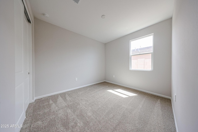 17716 W Fulton St, Goodyear, AZ 85338 - spare room with baseboards, carpet, and vaulted ceiling