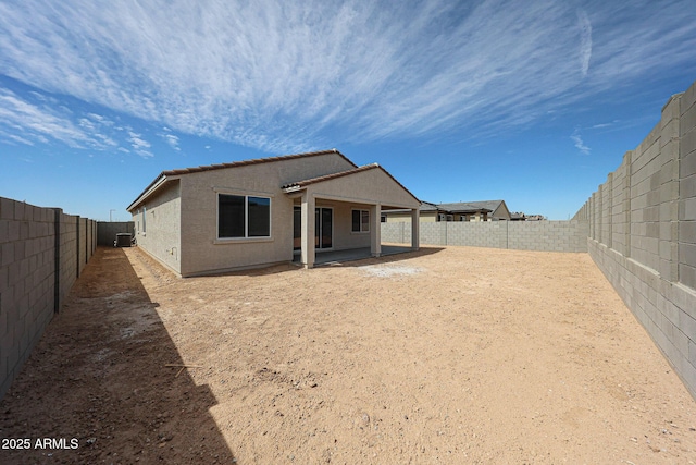 17716 W Fulton St, Goodyear, AZ 85338 - rear view of house with a fenced backyard, a patio area, and stucco siding