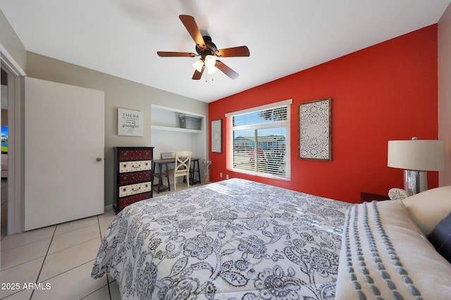 bedroom with a ceiling fan and tile patterned floors