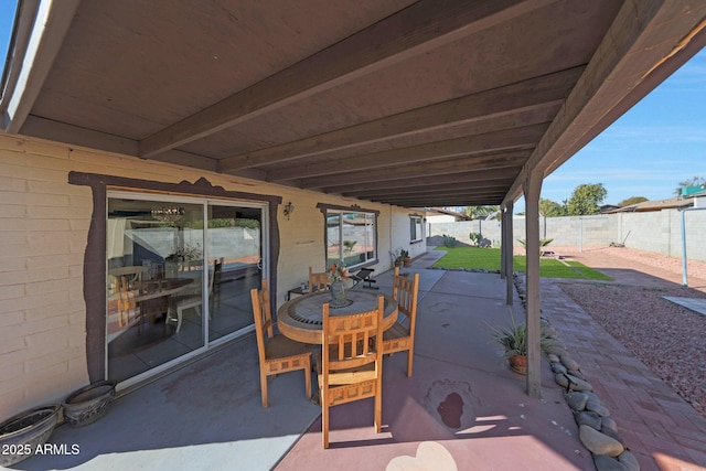 view of patio / terrace featuring fence