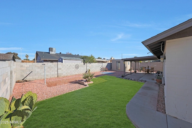 view of yard featuring a fenced backyard, a patio, and central air condition unit