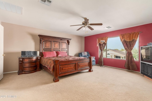 carpeted bedroom with visible vents and a ceiling fan