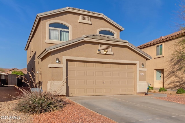 mediterranean / spanish home featuring a tile roof, concrete driveway, a garage, and stucco siding