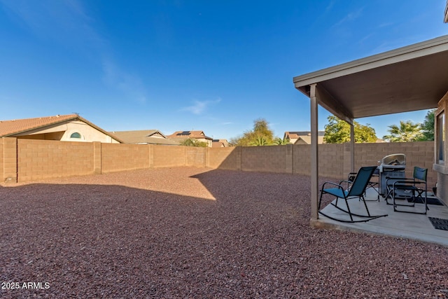 view of yard featuring a patio and a fenced backyard