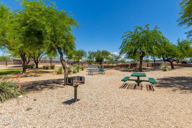 view of home's community with fence