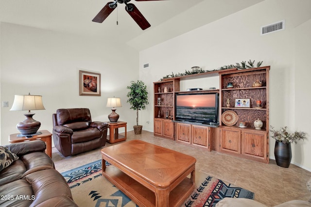 living room with high vaulted ceiling and ceiling fan