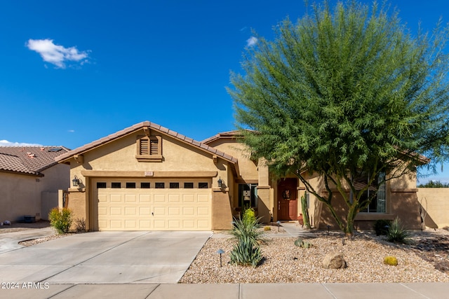 view of front of property with a garage