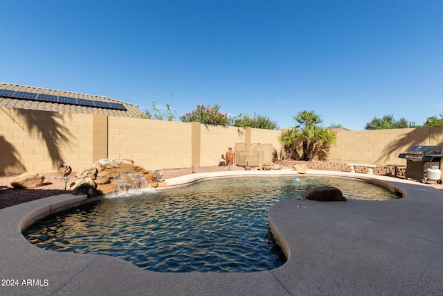 view of pool featuring pool water feature