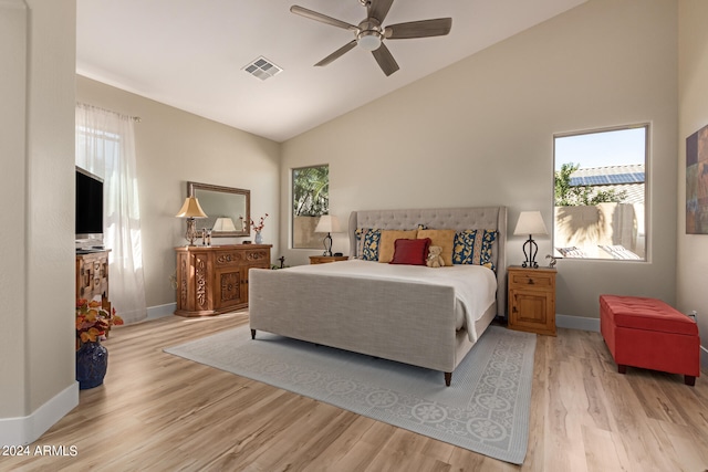 bedroom featuring lofted ceiling, light hardwood / wood-style floors, and ceiling fan