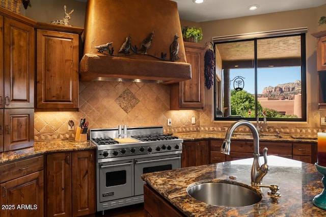 30 Paraiso Corte, Sedona, AZ 86351 - kitchen featuring double oven range, a sink, decorative backsplash, and dark stone countertops