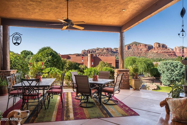 30 Paraiso Corte, Sedona, AZ 86351 - view of patio / terrace with outdoor dining space, ceiling fan, and a mountain view