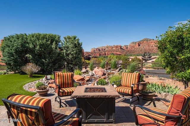 30 Paraiso Corte, Sedona, AZ 86351 - view of patio featuring a fire pit and a mountain view
