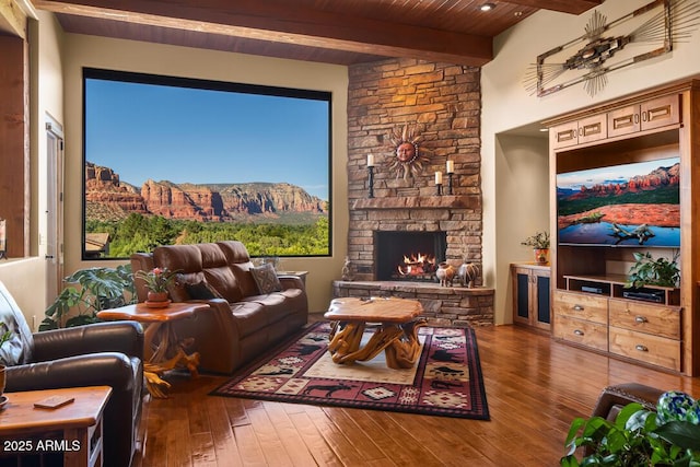 30 Paraiso Corte, Sedona, AZ 86351 - living room featuring hardwood / wood-style floors, wooden ceiling with exposed beams, and a stone fireplace
