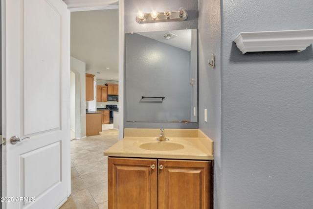 bathroom with tile patterned floors and vanity