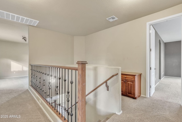 hallway with light carpet