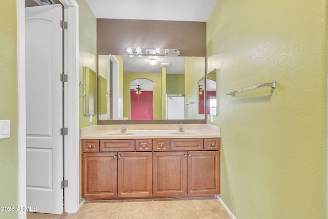 bathroom featuring tile patterned flooring and vanity