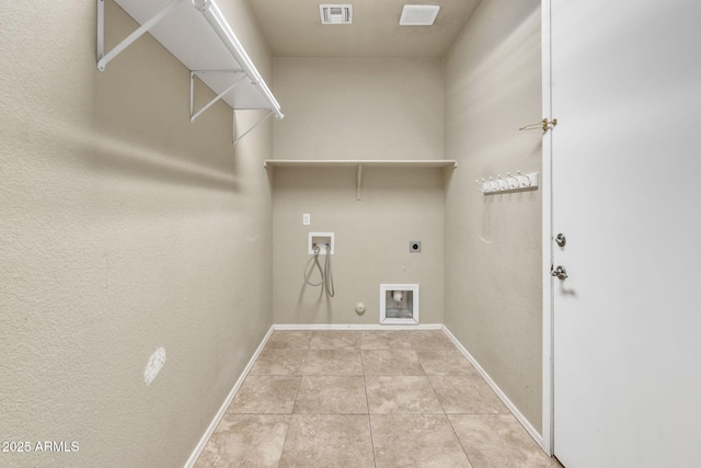 laundry area with electric dryer hookup, washer hookup, light tile patterned floors, and gas dryer hookup