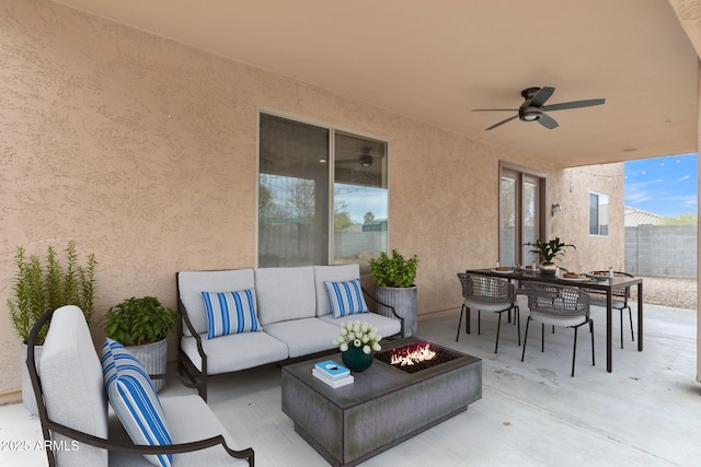 view of patio / terrace featuring an outdoor living space with a fire pit and ceiling fan